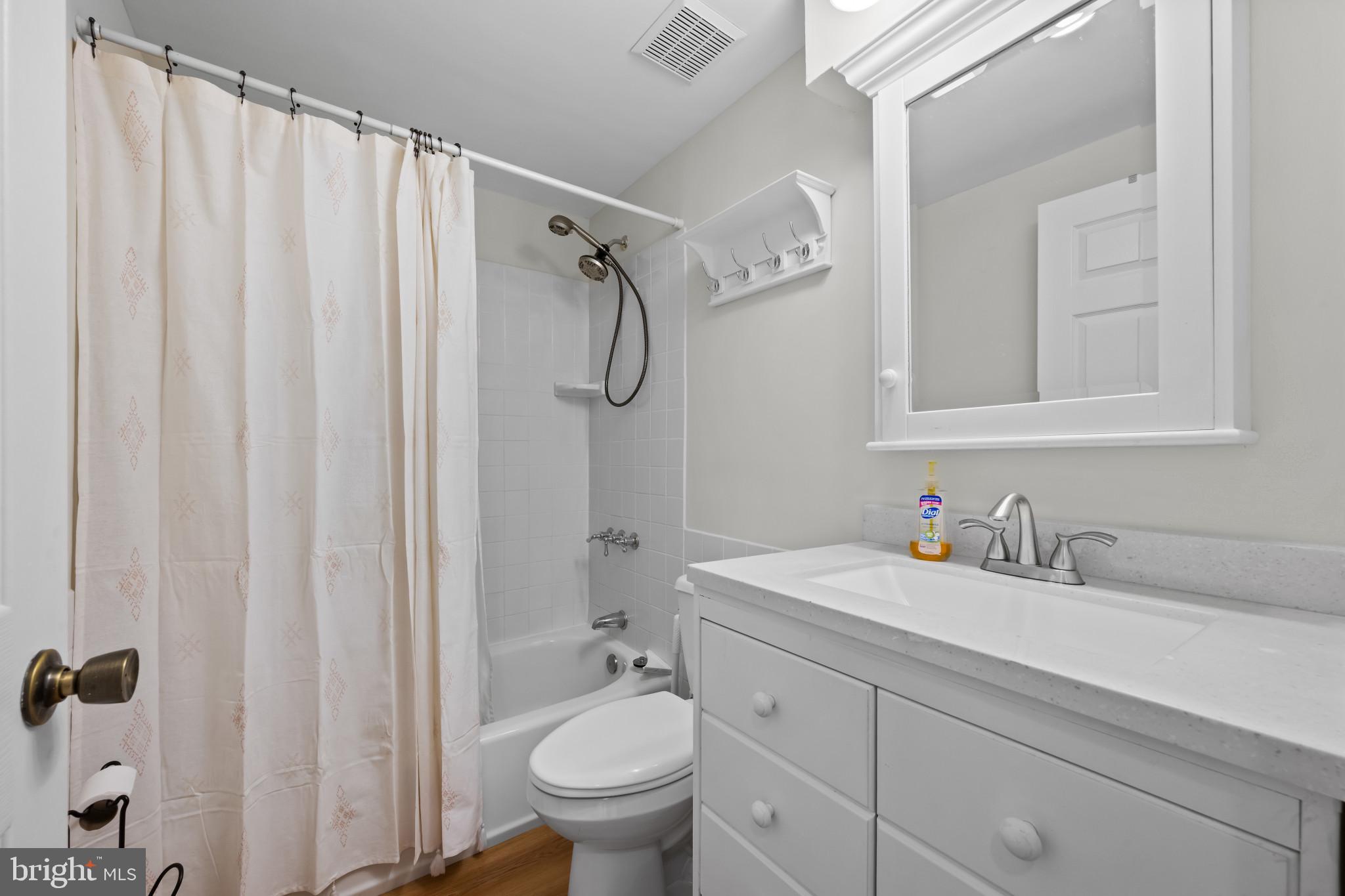 9281 Pigeon Wing Place Columbia, MD 21045 - Photo 23 of 55 a bathroom with a granite countertop sink toilet and shower