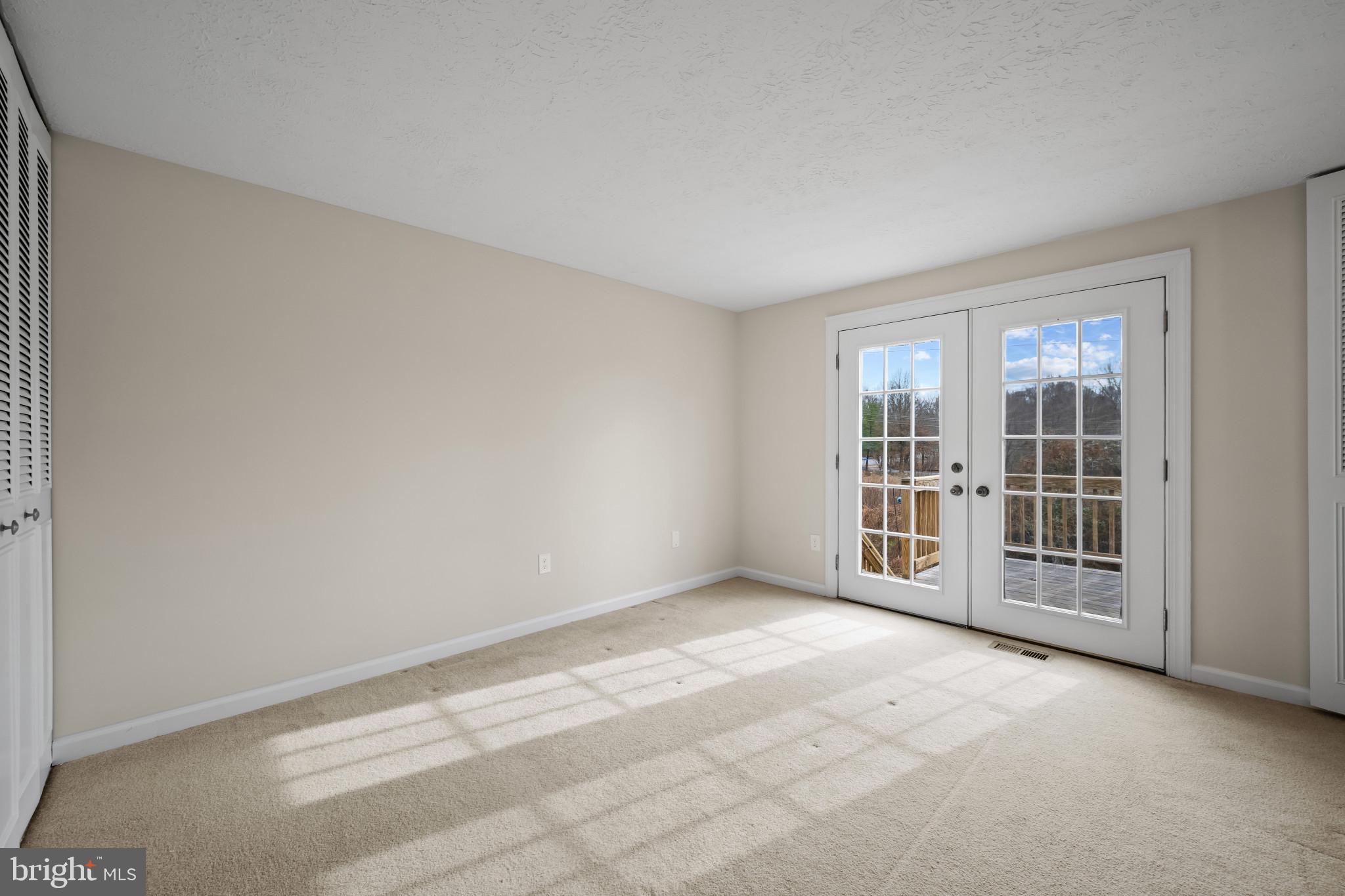 9281 Pigeon Wing Place Columbia, MD 21045 - Photo 25 of 55 an empty room with windows