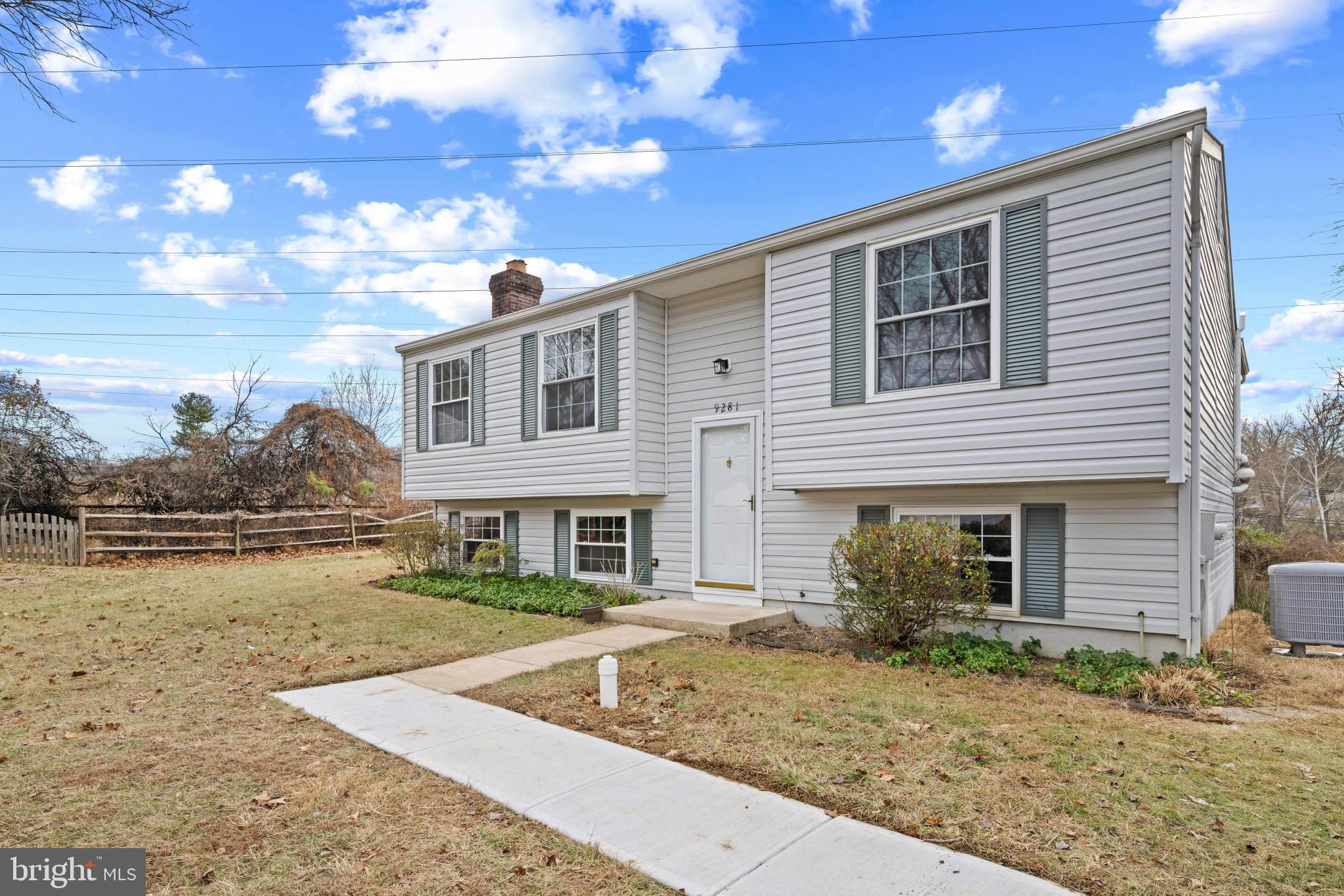 9281 Pigeon Wing Place Columbia, MD 21045 - Photo 3 of 55 a front view of a house with garden