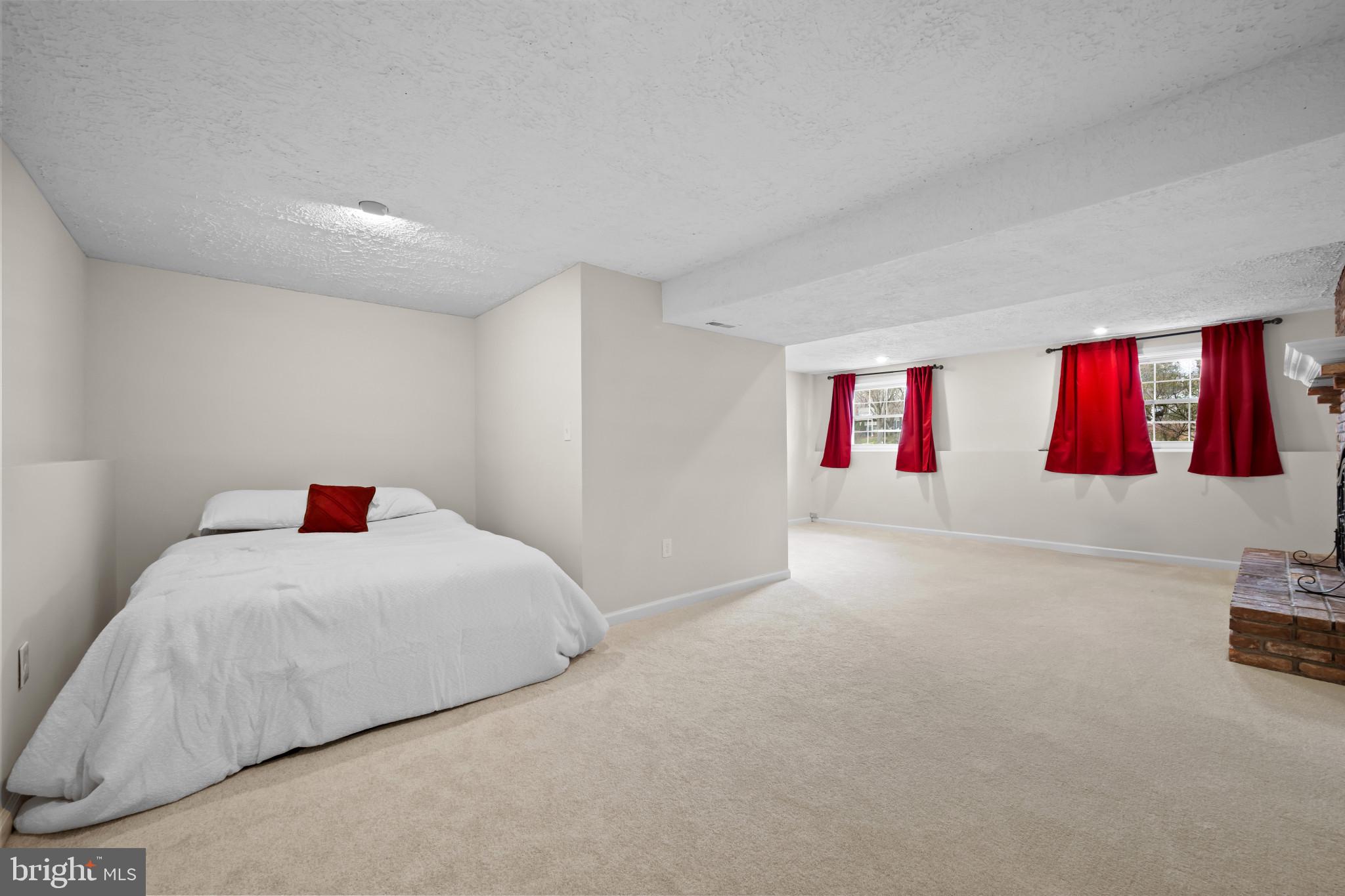 9281 Pigeon Wing Place Columbia, MD 21045 - Photo 39 of 55 a bedroom with a bed and cabinets