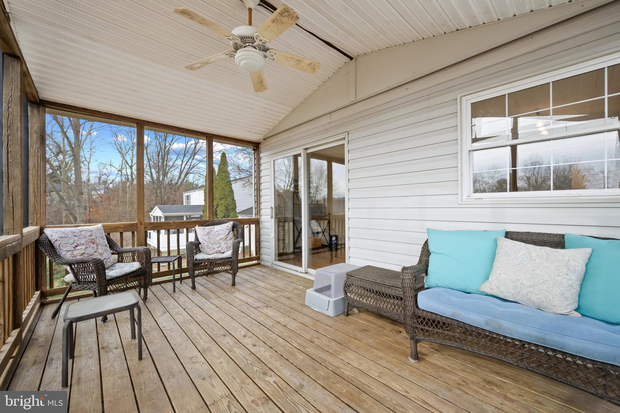 9281 Pigeon Wing Place Columbia, MD 21045 - Photo 44 of 55 a living room with furniture and a floor to ceiling window