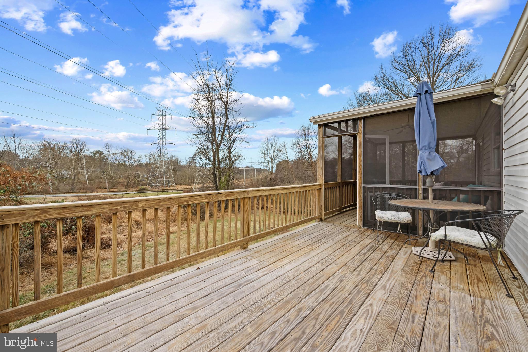 9281 Pigeon Wing Place Columbia, MD 21045 - Photo 47 of 55 a view of a balcony with wooden floor and iron fence