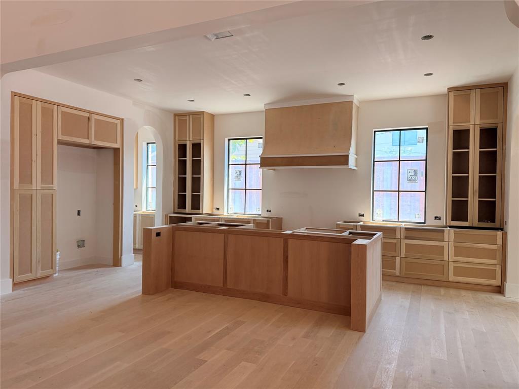 3830 Dunhaven Road Dallas, TX 75220 - Photo 6 of 21 a large kitchen with granite countertop a stove and a sink