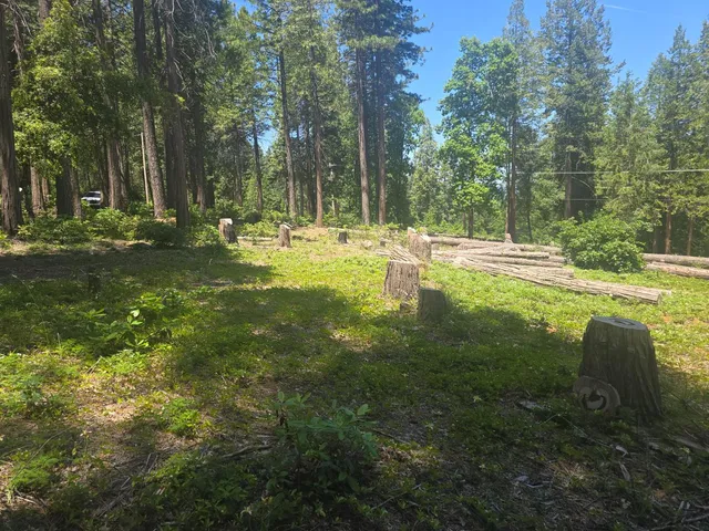 a swimming pool with outdoor seating and yard