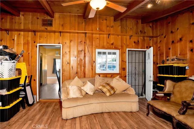 a room with wooden floors and furniture