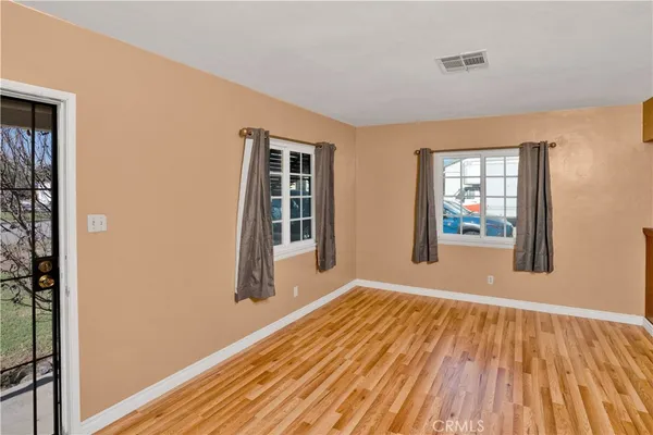 a room with a bed and a ceiling fan