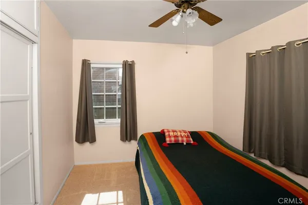 a room with a dresser and a flat screen tv