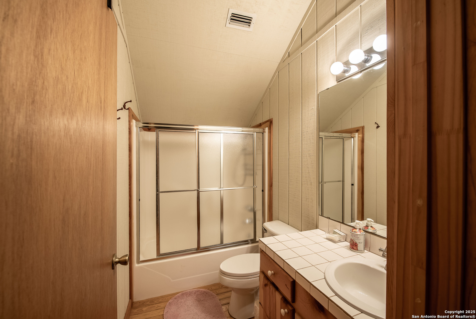 50 Indian Paint Brush Road Concan, TX 78838 - Photo 13 of 21 a bathroom with a granite countertop sink toilet and shower