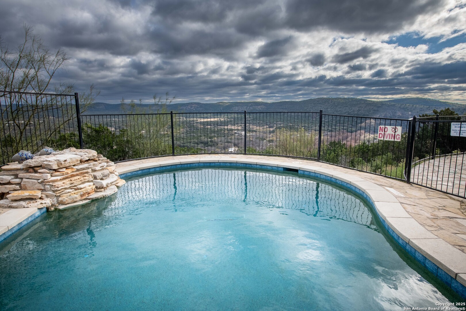 50 Indian Paint Brush Road Concan, TX 78838 - Photo 5 of 21 a view of swimming pool with a yard