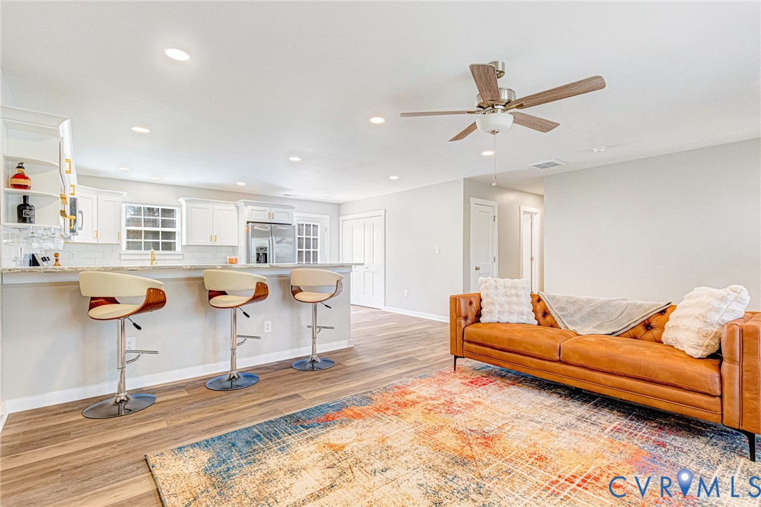 5301 Pine Fork Road Quinton, VA 23141 - Photo 11 of 41 a living room with furniture pool and a rug