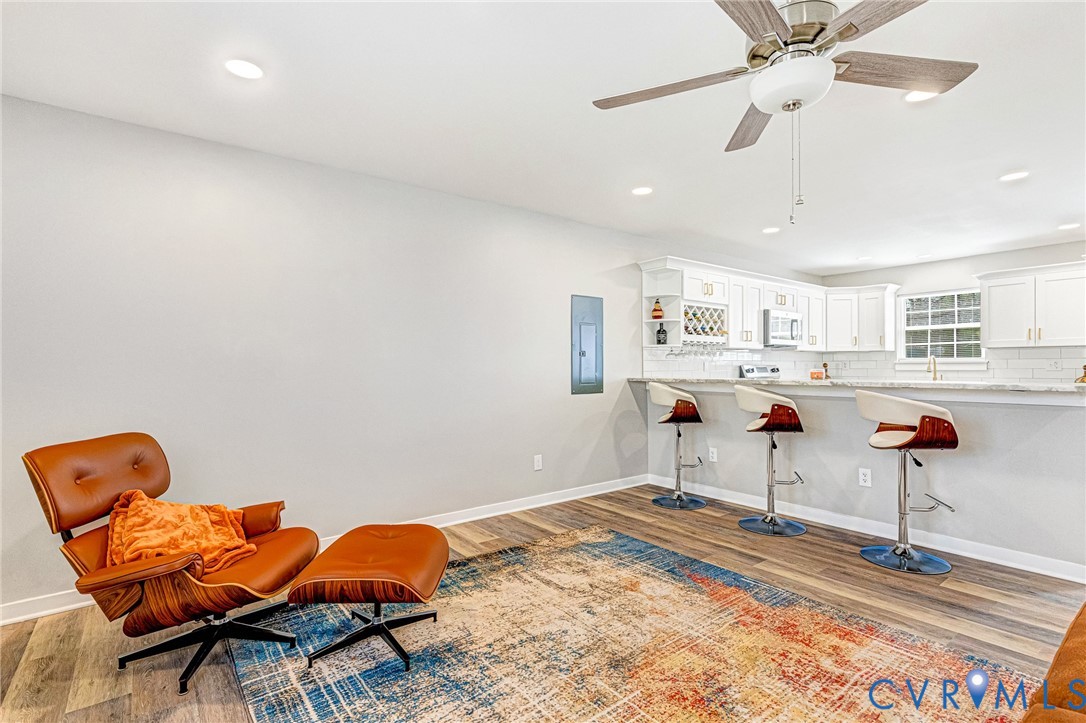 5301 Pine Fork Road Quinton, VA 23141 - Photo 15 of 41 a living room with furniture and a chandelier
