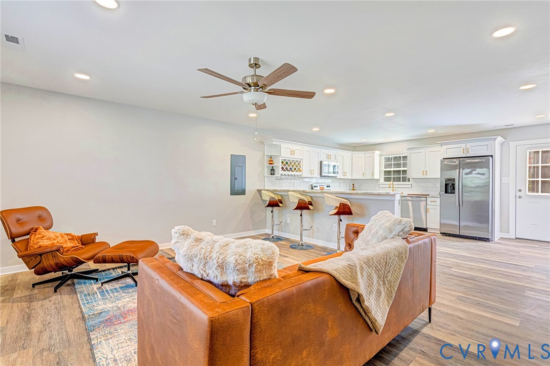 5301 Pine Fork Road Quinton, VA 23141 - Photo 16 of 41 a living room with furniture and a wooden floor