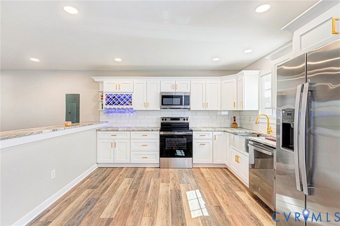 5301 Pine Fork Road Quinton, VA 23141 - Photo 20 of 41 a kitchen with granite countertop appliances cabinets and a sink