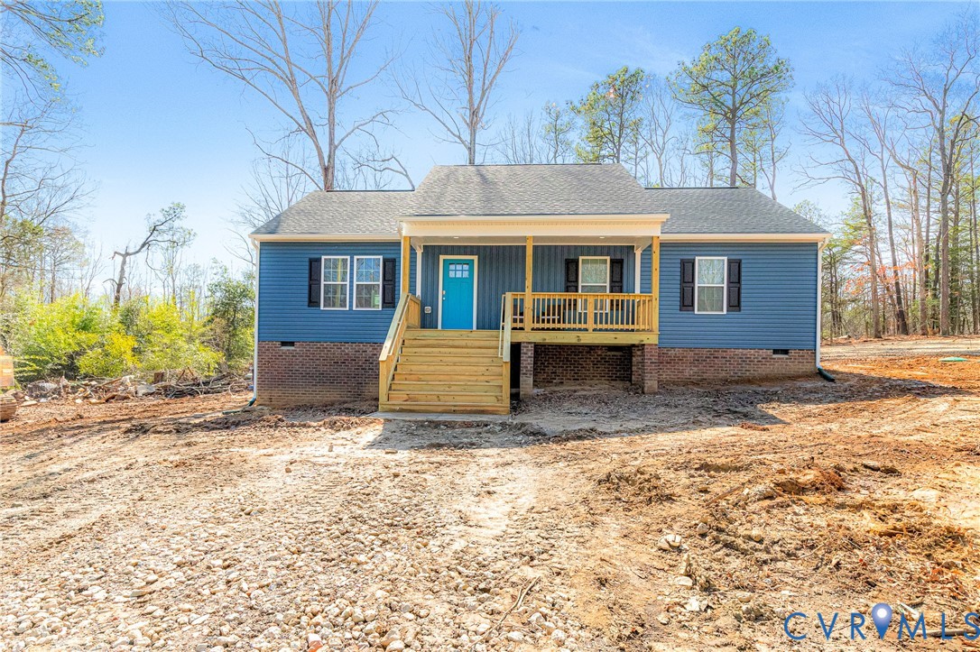 5301 Pine Fork Road Quinton, VA 23141 - Photo 2 of 41 a front view of a house with a yard and potted plants