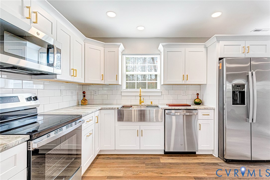 5301 Pine Fork Road Quinton, VA 23141 - Photo 21 of 41 a kitchen with stainless steel appliances granite countertop a refrigerator sink and cabinets