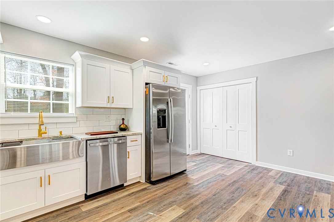 5301 Pine Fork Road Quinton, VA 23141 - Photo 22 of 41 a kitchen with stainless steel appliances granite countertop a refrigerator and a sink
