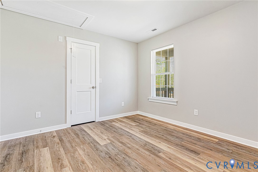 5301 Pine Fork Road Quinton, VA 23141 - Photo 27 of 41 a view of an empty room with wooden floor and a window