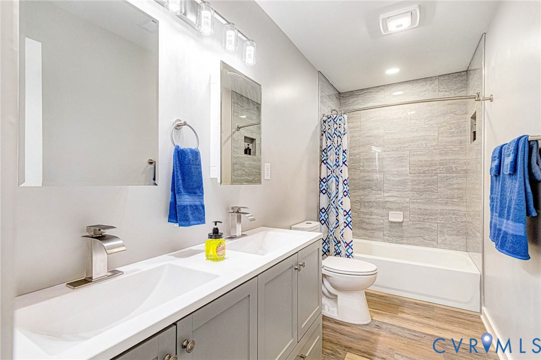 5301 Pine Fork Road Quinton, VA 23141 - Photo 31 of 41 a bathroom with a sink a toilet and shower