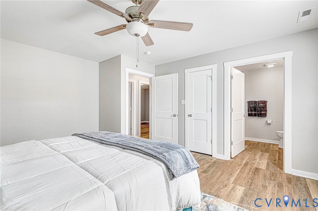 5301 Pine Fork Road Quinton, VA 23141 - Photo 33 of 41 a bedroom with a bed and a chandelier