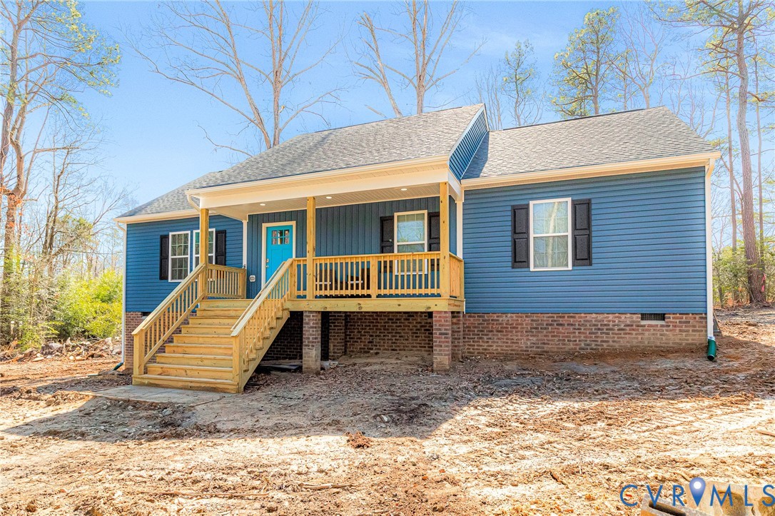 5301 Pine Fork Road Quinton, VA 23141 - Photo 4 of 41 a view of a house with a yard chairs and wooden fence