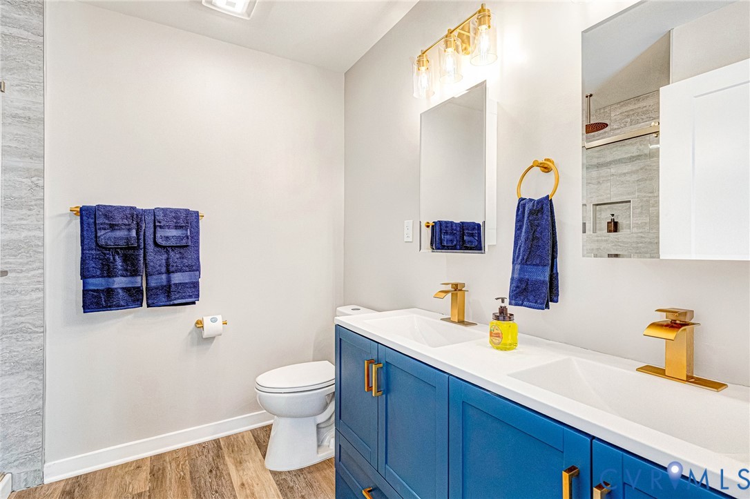 5301 Pine Fork Road Quinton, VA 23141 - Photo 41 of 41 a bathroom with a sink a toilet and mirror