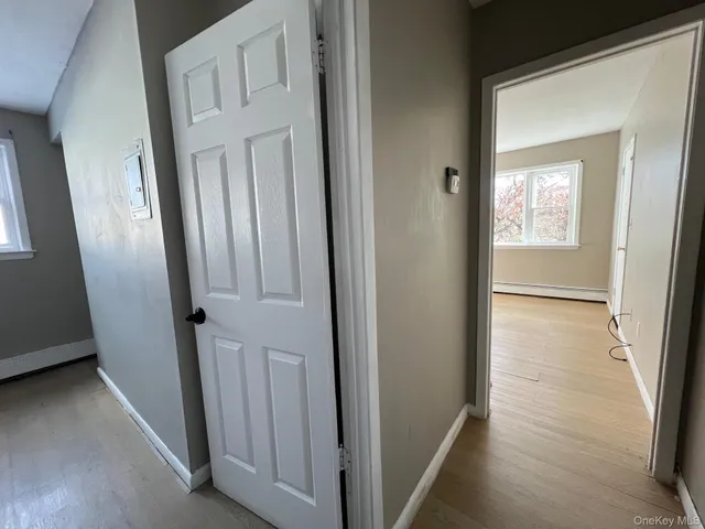 a view of a bathroom from a hallway