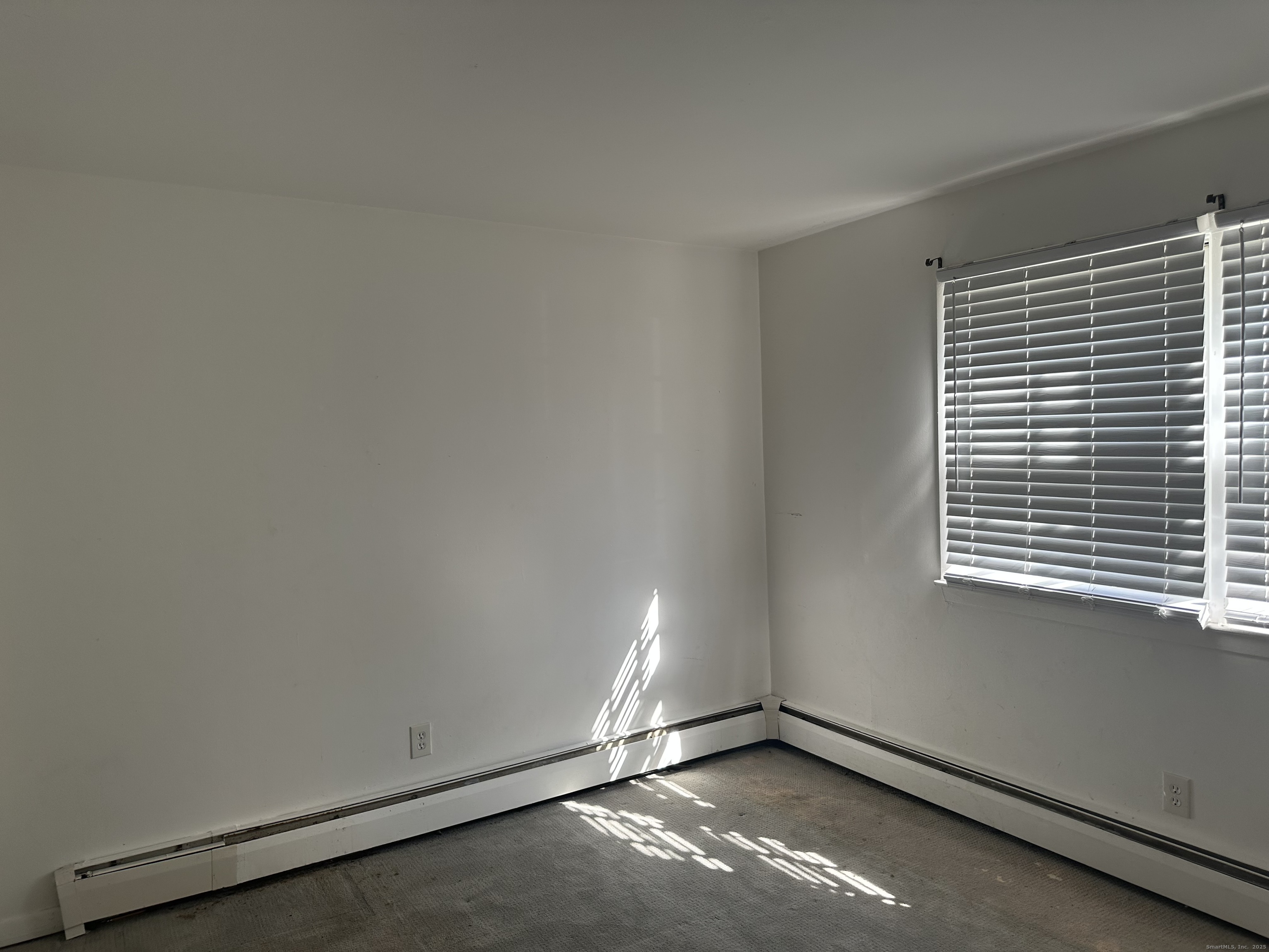 5 Treat Street, Unit 2A West Haven, CT 06516 - Photo 11 of 15 an empty room with a window