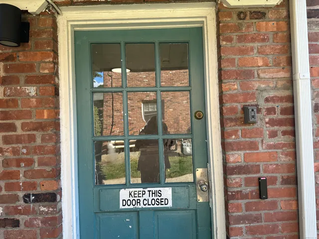 a bathroom with a shower and a sink