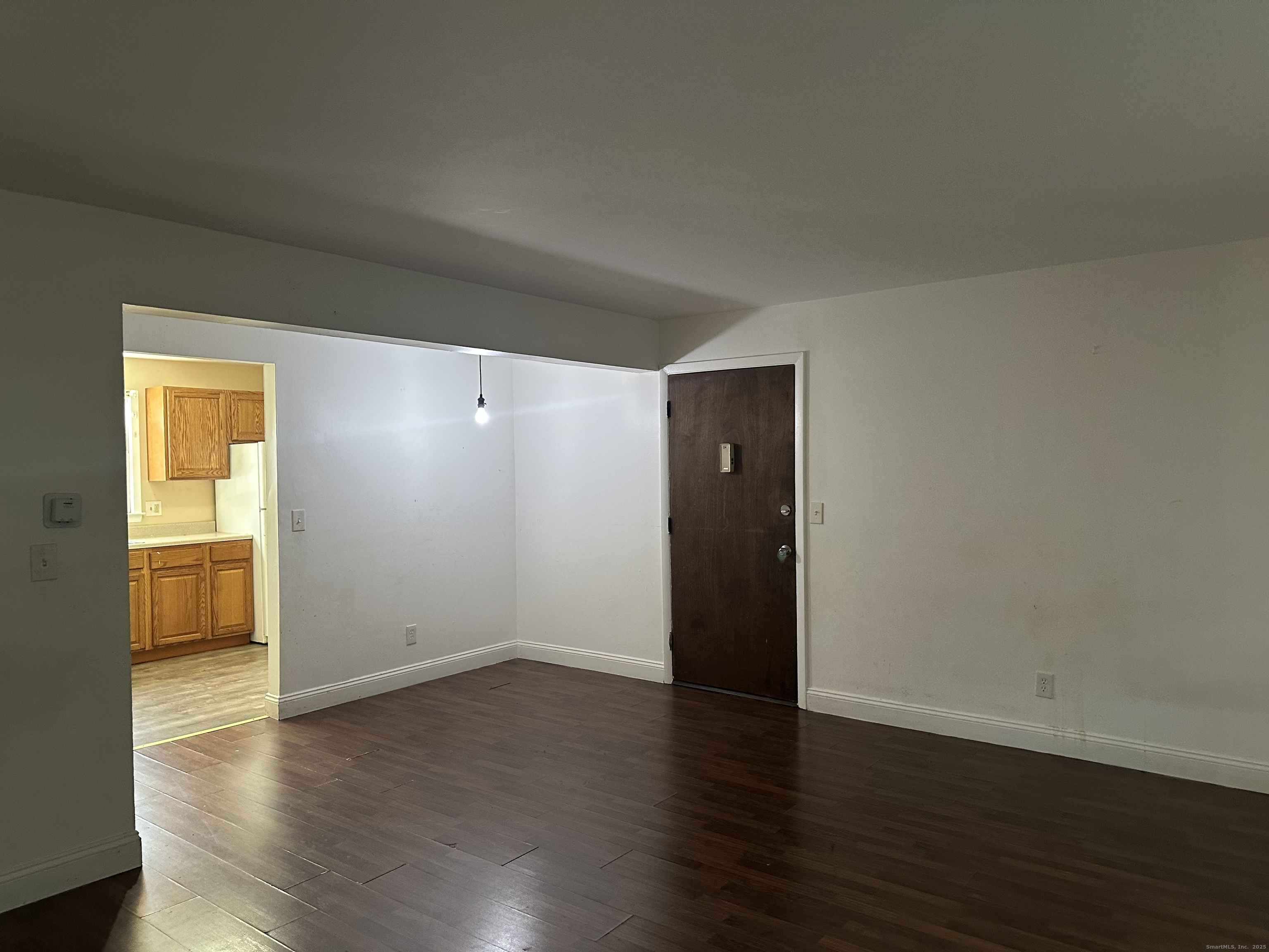 5 Treat Street, Unit 2A West Haven, CT 06516 - Photo 5 of 15 a view of an empty room with wooden floor and a window