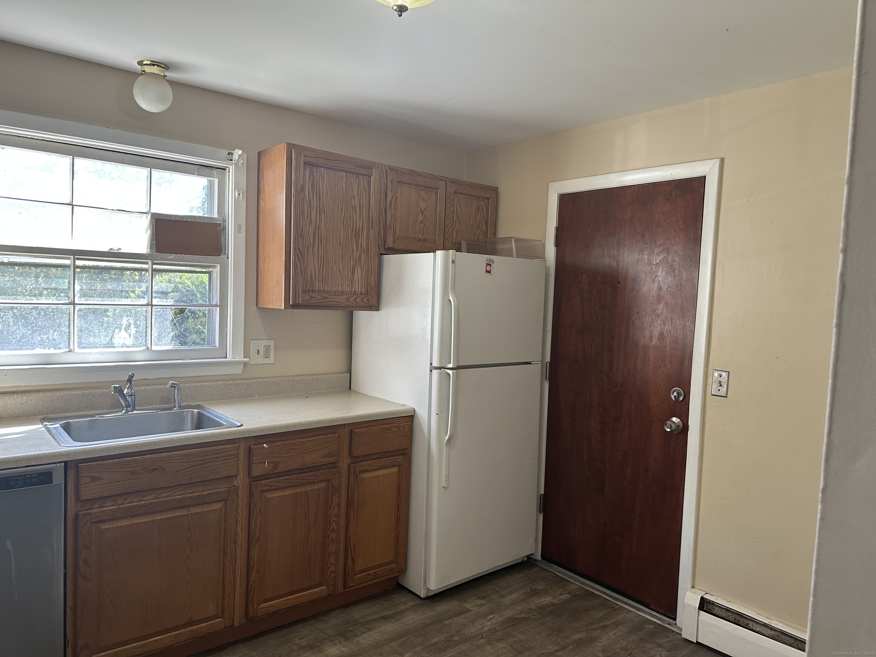 5 Treat Street, Unit 2A West Haven, CT 06516 - Photo 6 of 15 a kitchen with a refrigerator sink and cabinets