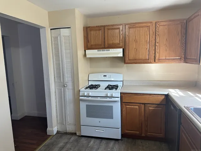 a kitchen with a stove and a sink