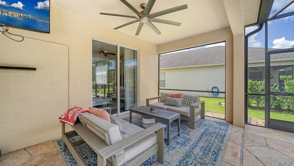 6122 Blue Runner Court Lakewood Ranch, FL 34202 - Photo 7 of 53 a living room with furniture and a window