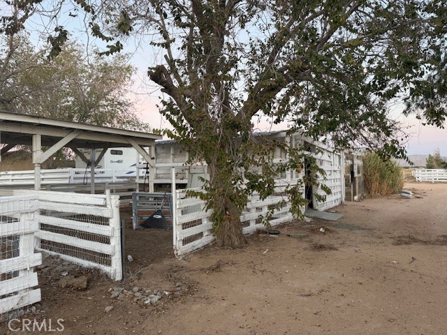 16100 Navajo Road Apple Valley, CA 92307 - Photo 13 of 55 a view of a house with a tree
