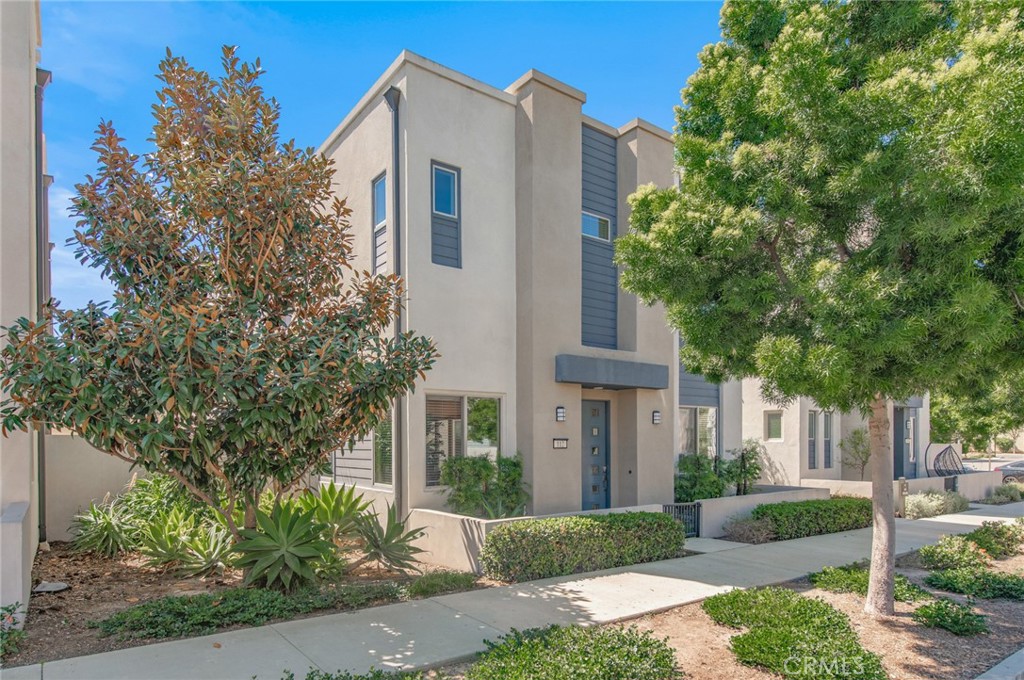 112 Stellar Irvine, CA 92618 - Photo 1 of 1 a front view of a house with a yard and trees