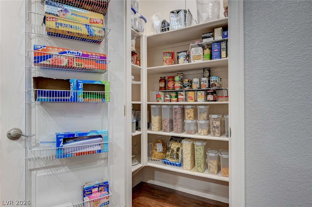 1604 Cattle Ranch Place Henderson, NV 89002 - Photo 30 of 99 Organized shelving and door racks provide abundant storage within this dedicated pantry space.