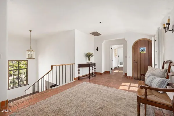 a spacious bedroom with a bed and a couch