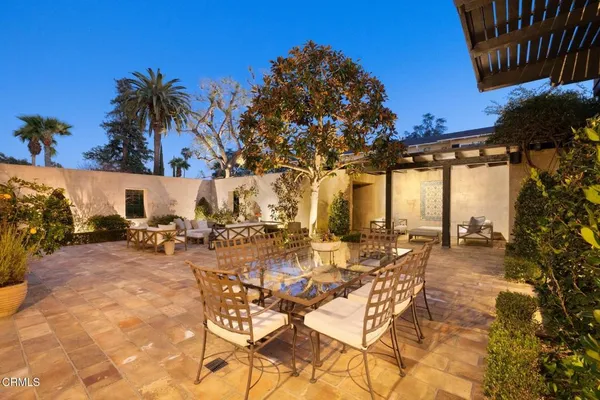 a outdoor space with patio lots of furniture and umbrella