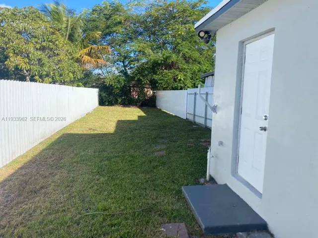 a view of backyard with green space