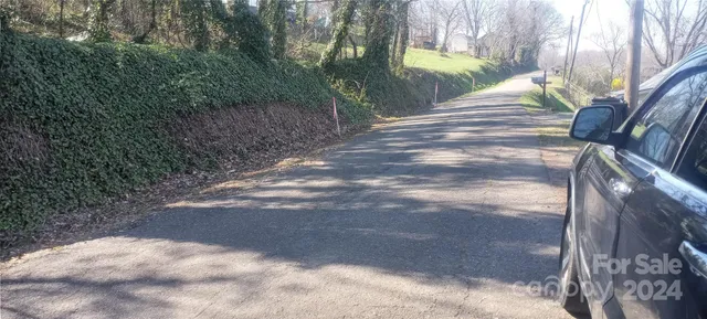 a view of pathway with a yard