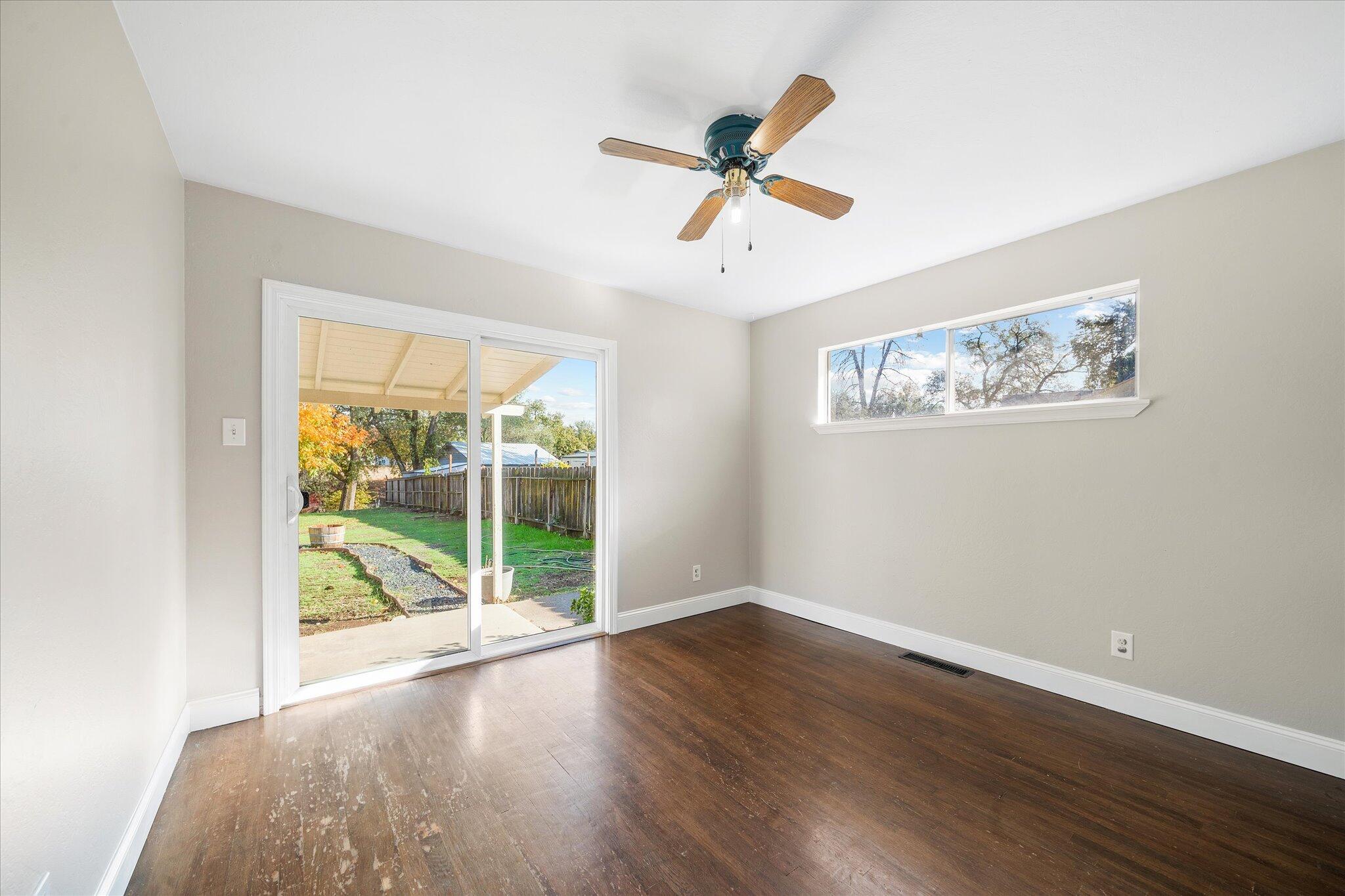 2717 Henderson Road Redding, CA 96002 - Photo 13 of 34 a view of a room with wooden floor fan and a window