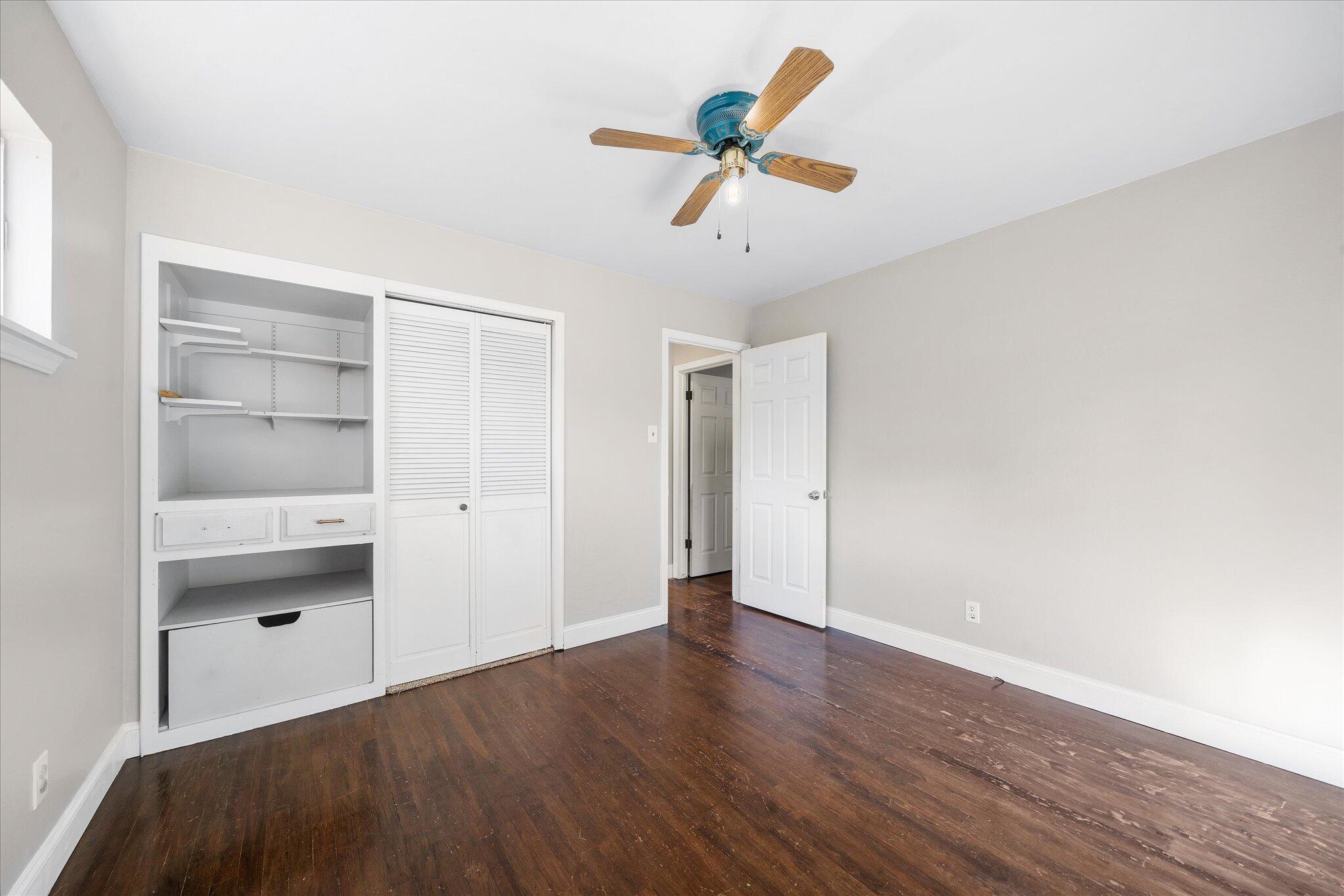 2717 Henderson Road Redding, CA 96002 - Photo 14 of 34 a view of empty room with wooden floor and ceiling fan