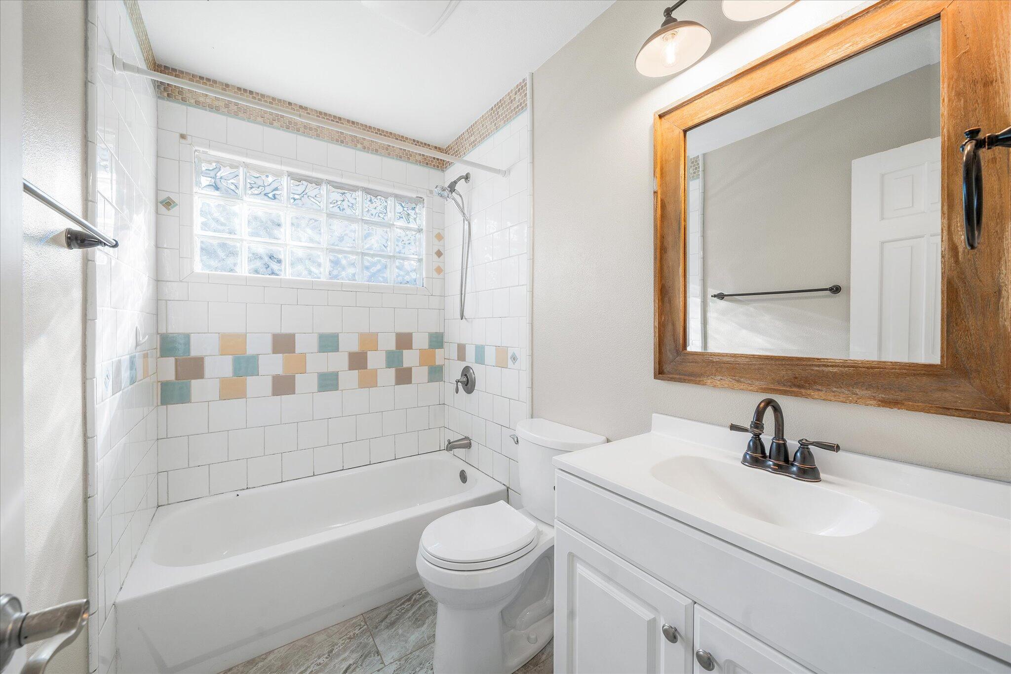 2717 Henderson Road Redding, CA 96002 - Photo 15 of 34 a bathroom with a sink a toilet and shower