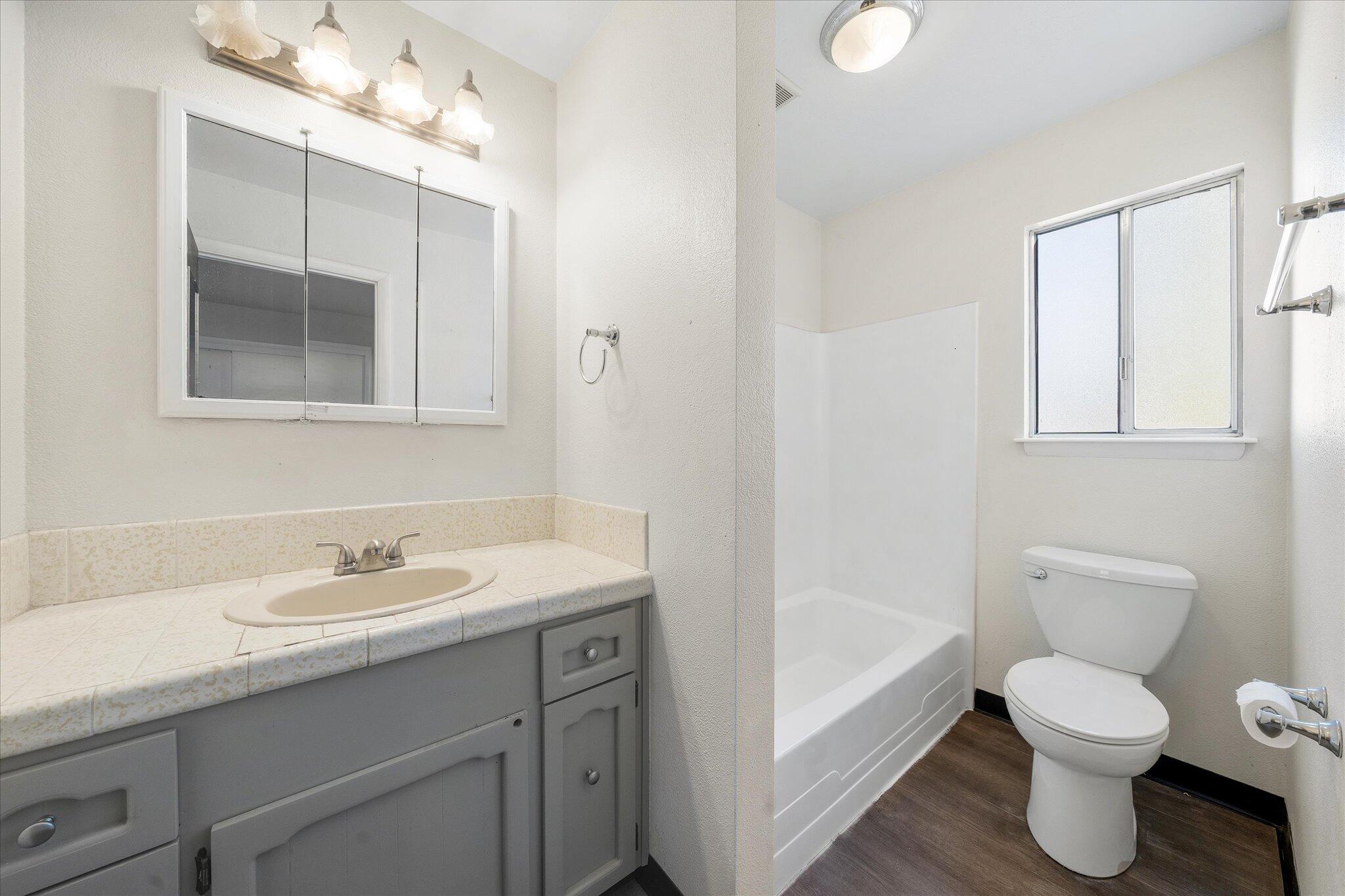 2717 Henderson Road Redding, CA 96002 - Photo 19 of 34 a bathroom with a sink toilet and shower