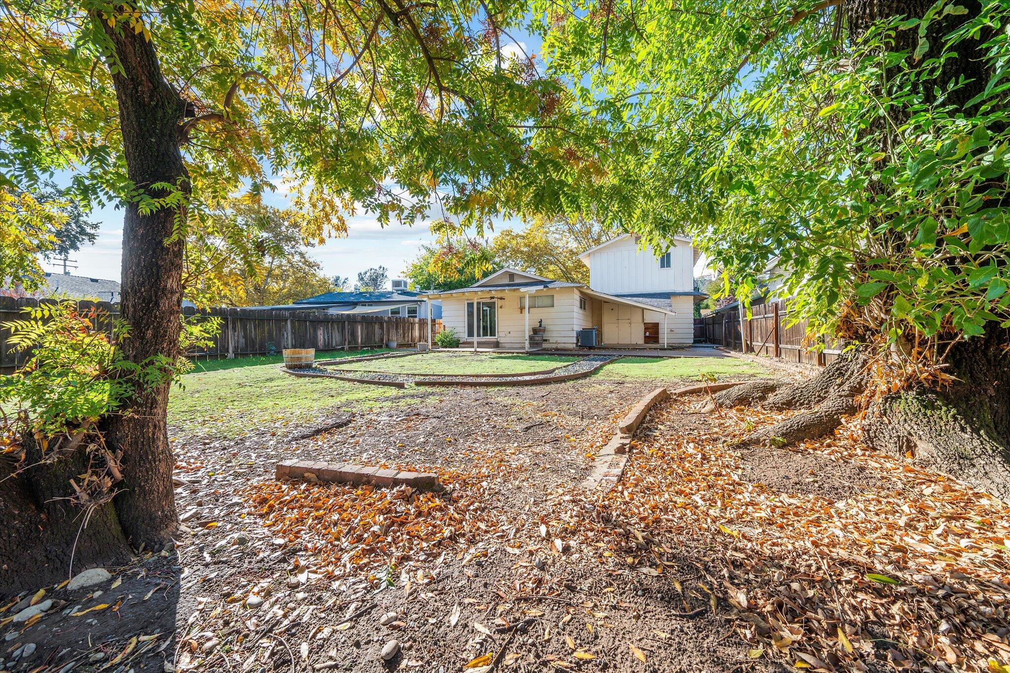 2717 Henderson Road Redding, CA 96002 - Photo 24 of 34 a view of a house with a yard