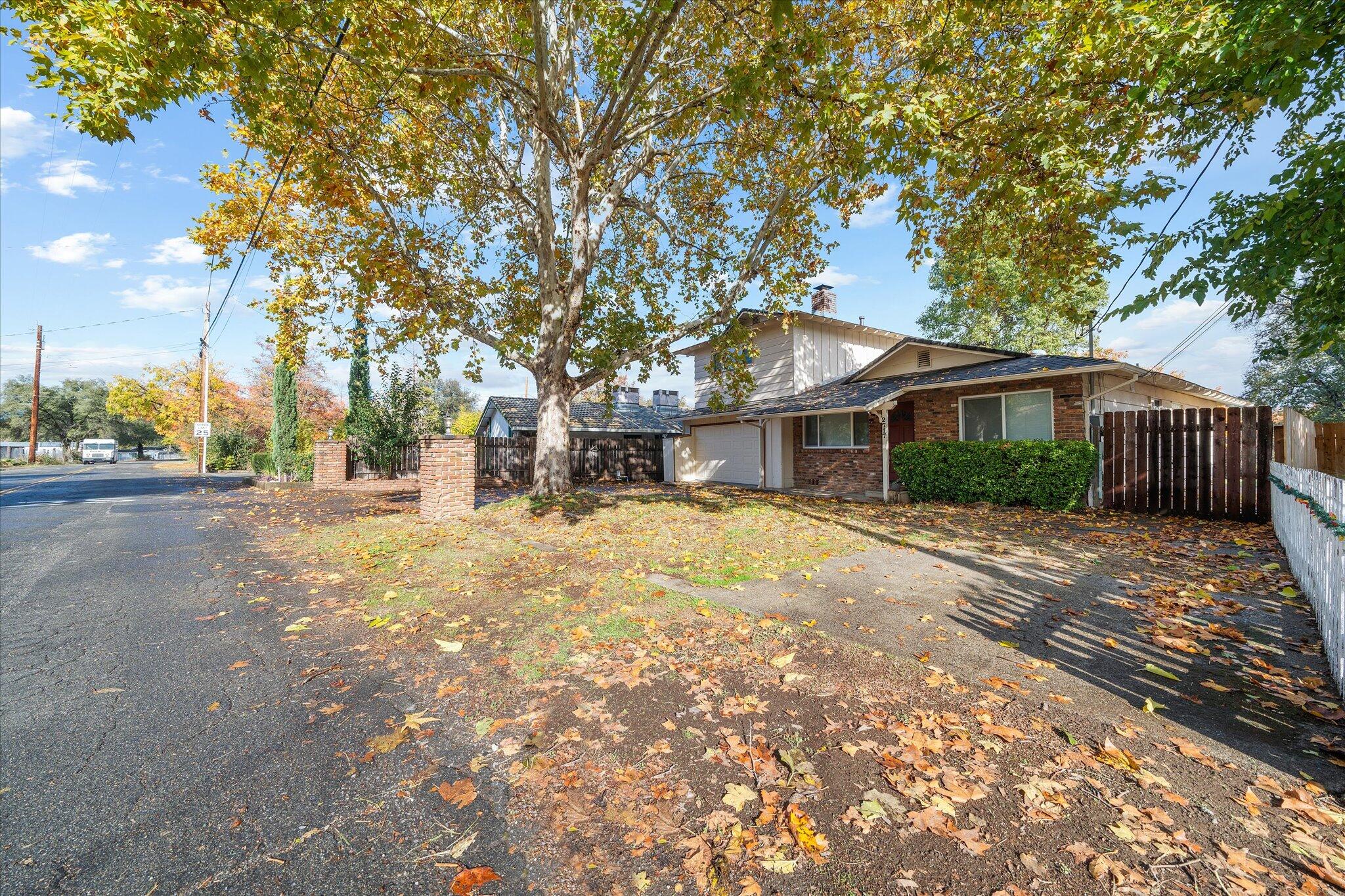2717 Henderson Road Redding, CA 96002 - Photo 29 of 34 a front view of a house with a yard