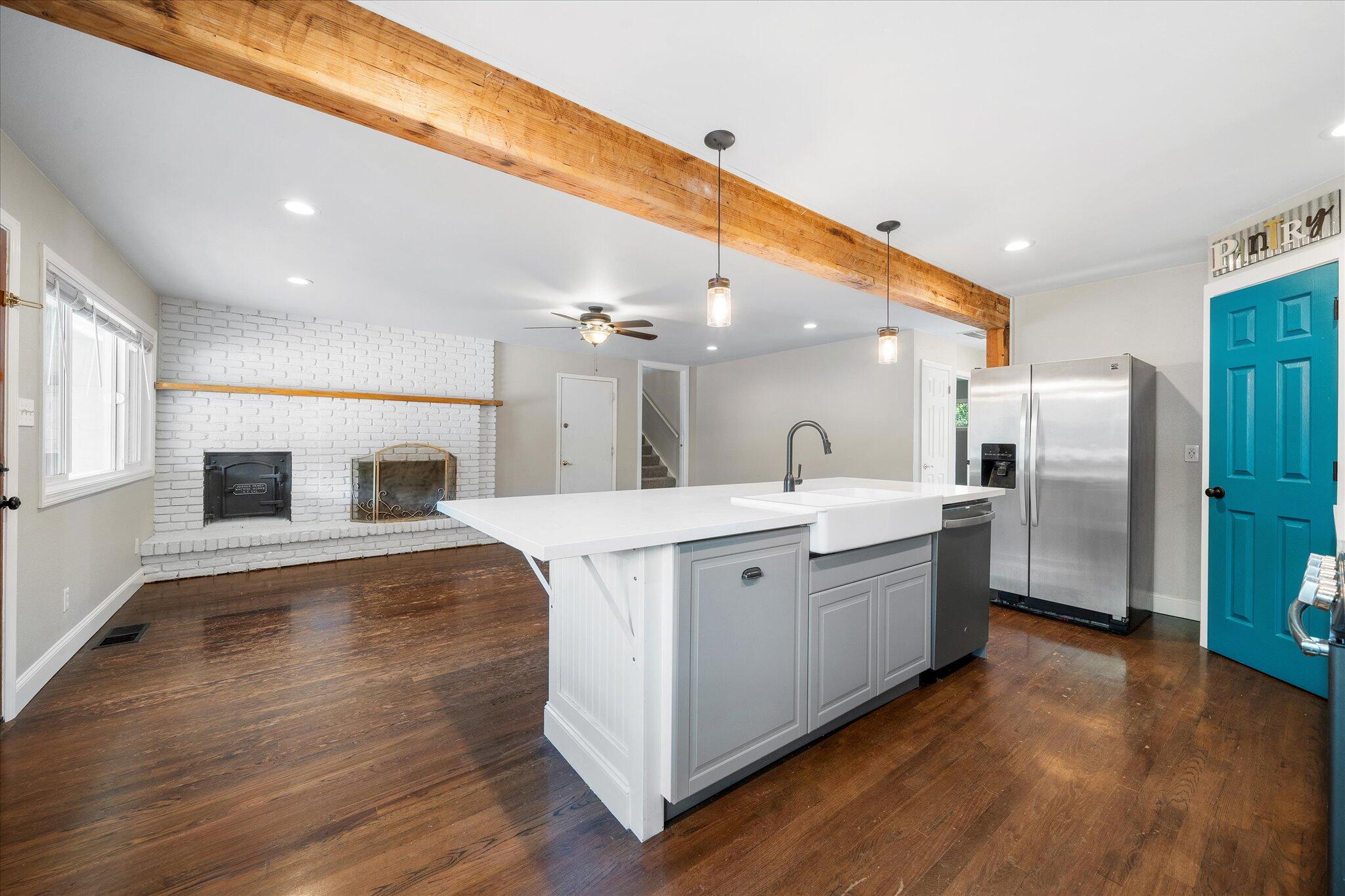 2717 Henderson Road Redding, CA 96002 - Photo 9 of 34 a large white kitchen with a refrigerator a sink and a stove