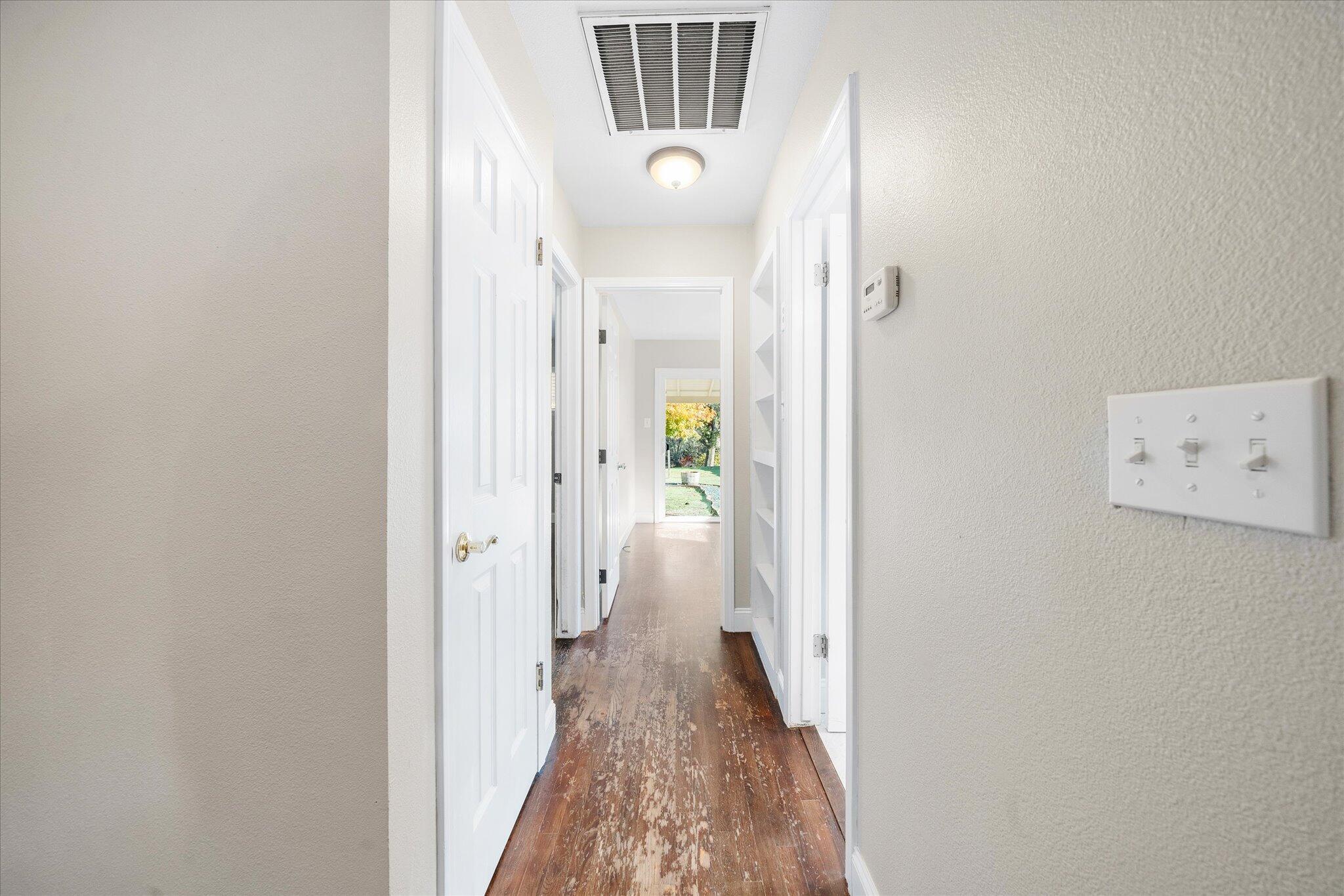 2717 Henderson Road Redding, CA 96002 - Photo 10 of 34 a view of a hallway with white walls