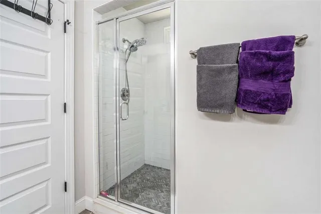 a bathroom with a tub and shower