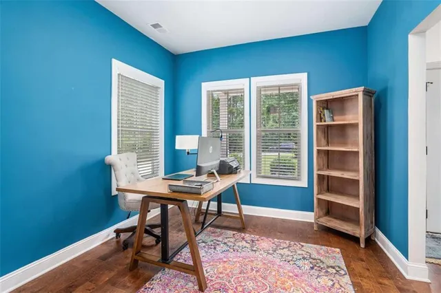 a workspace with furniture and a window