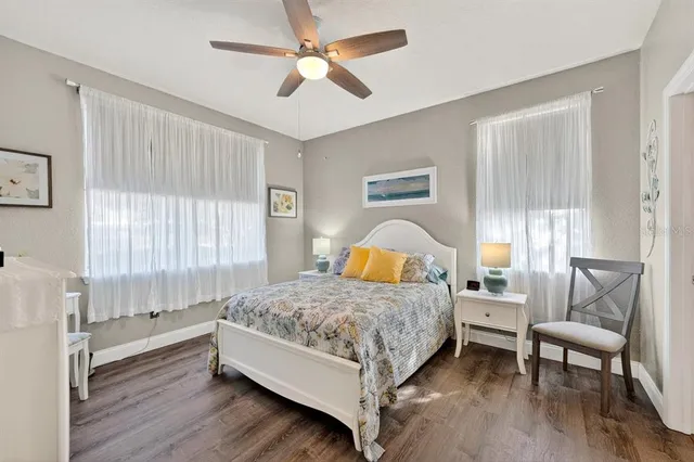 a bedroom with a bed and a chair